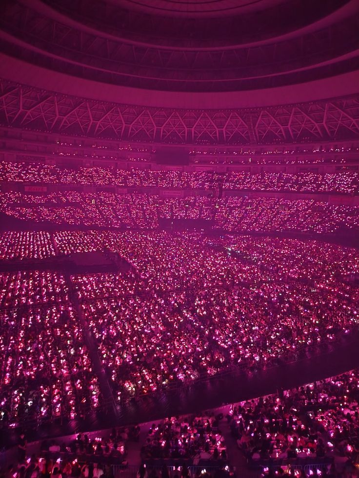 a large room filled with lots of pink lights in the middle of it's ceiling