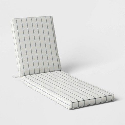 a white chair cushion with pinstripe pattern on the back and sides, sitting in front of a white background