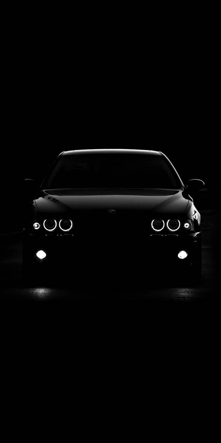 a car is shown in the dark with its headlights turned on and it's headlight up