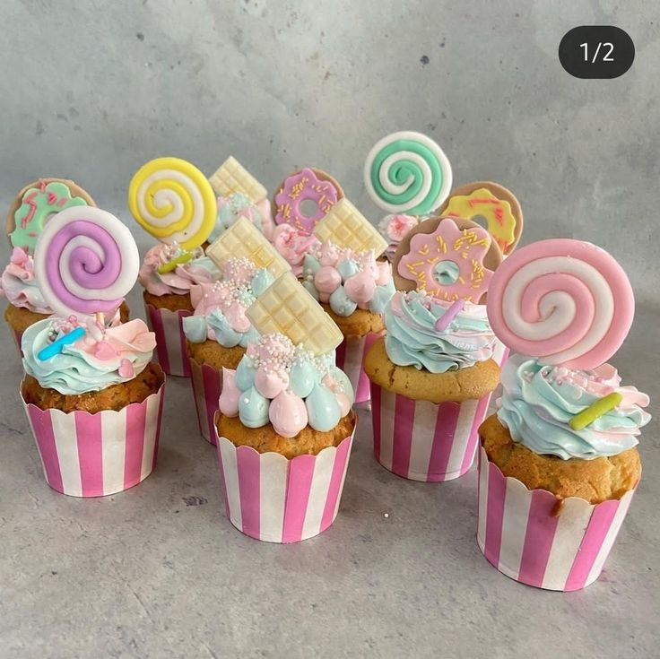 some cupcakes are decorated with candy and candies