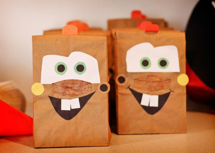 two brown paper bags with faces on them