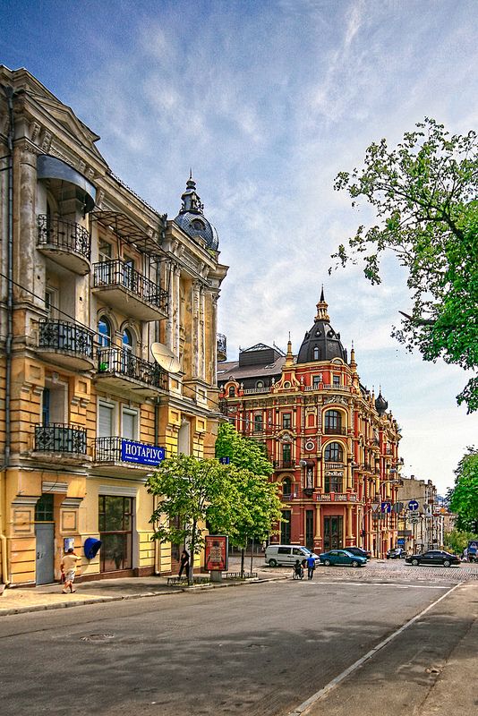 an empty city street with buildings on both sides