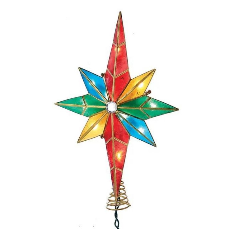 a red and green christmas star decoration on a white background