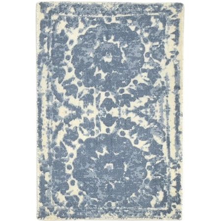 a blue and white rug with an ornate design on the bottom, in front of a white background