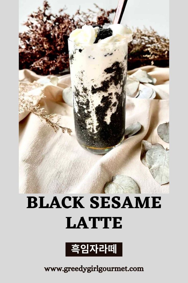 black sesame latte in a glass with ice cream on top and seaweed around it