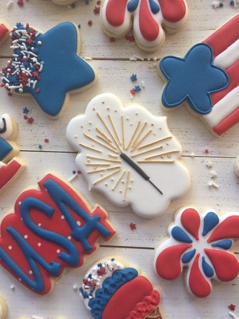 decorated cookies with the words happy new year and fireworks on them are laid out in rows