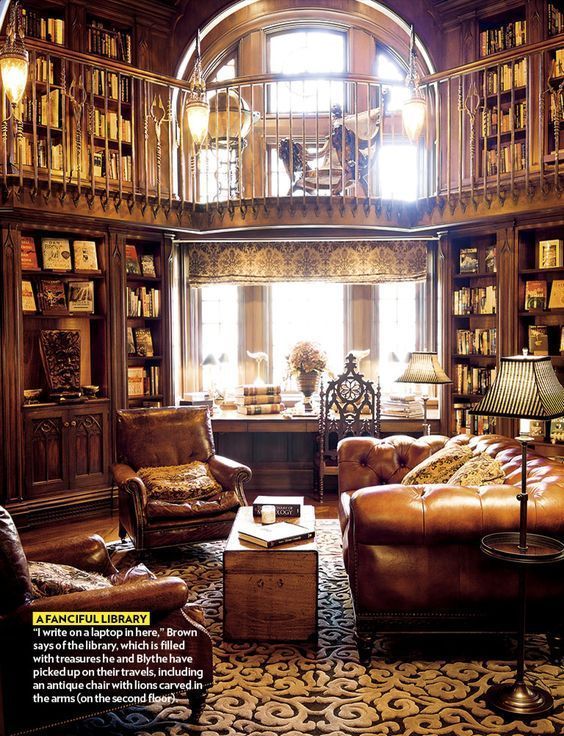 a living room filled with lots of furniture and bookshelves covered in wooden bookcases