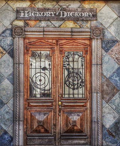 an ornate wooden door with two glass panels