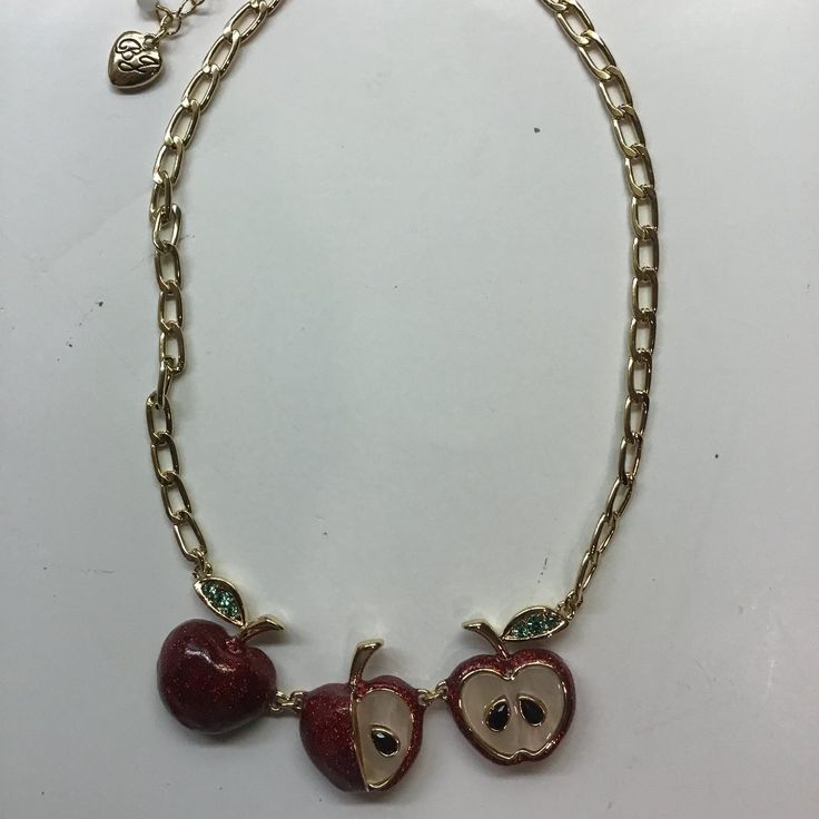 15-1/2" Gold Chain Inclusive Of 3-1/2" Of Design Consisting Of 3 Iridescent Red Apples, 1" In Width, With Green Rhinestone Leaves On The Outer Edges. One Apple Is Cut In Half With 2 Black Seeds On White Alabaster Surface, The Middle Apple Has 1/4 Missing Revealing 1 Black Seed, And The Third Apple Is Whole. Lobster Claw Closure, 3" Extender, And Betsey Heart. Gold Findings. Retail - $58. Nwt Snack Necklace, Apple Jewelry, Apple Fashion, Apple Necklace, B Day Gifts, Pink Camera, Pumpkin Necklace, Cherry Necklace, Bunny Necklace