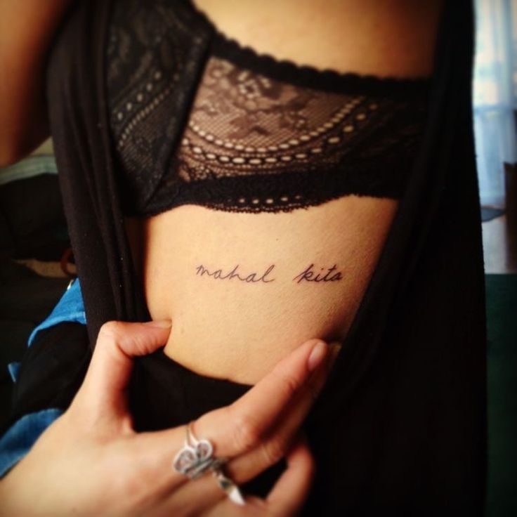 a woman's stomach with the word michael pike written on it, in cursive writing