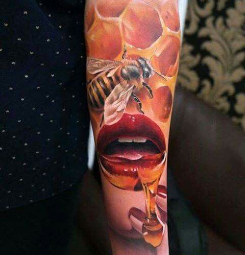 a woman's arm with a honey and lipstick tattoo on the left side of her body