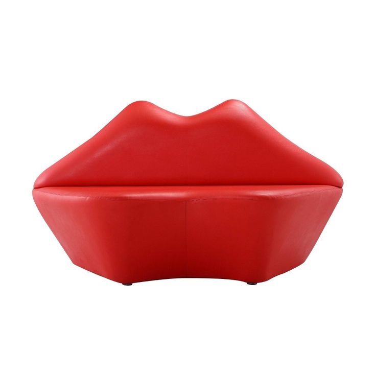 a red lip shaped bowl sitting on top of a white table