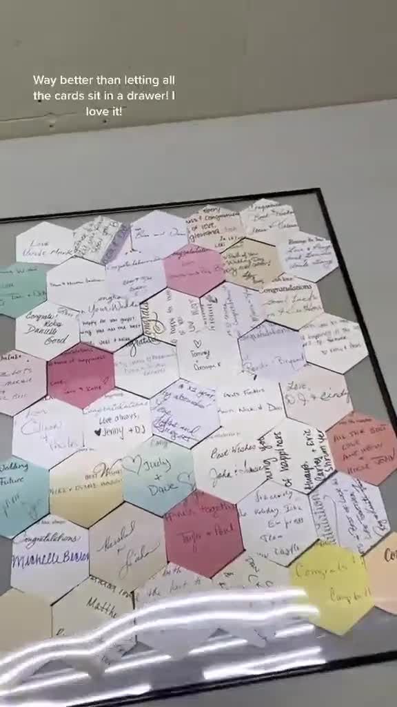 a display case with many different types of writing on the sides and in hexagonal shapes