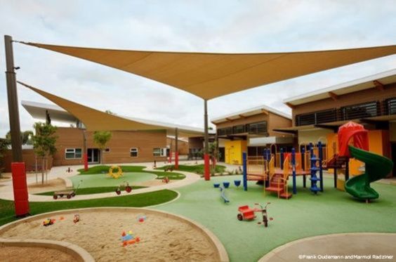 an outdoor play area with children's playground equipment