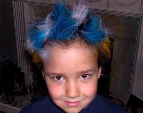 a young boy with blue and yellow hair