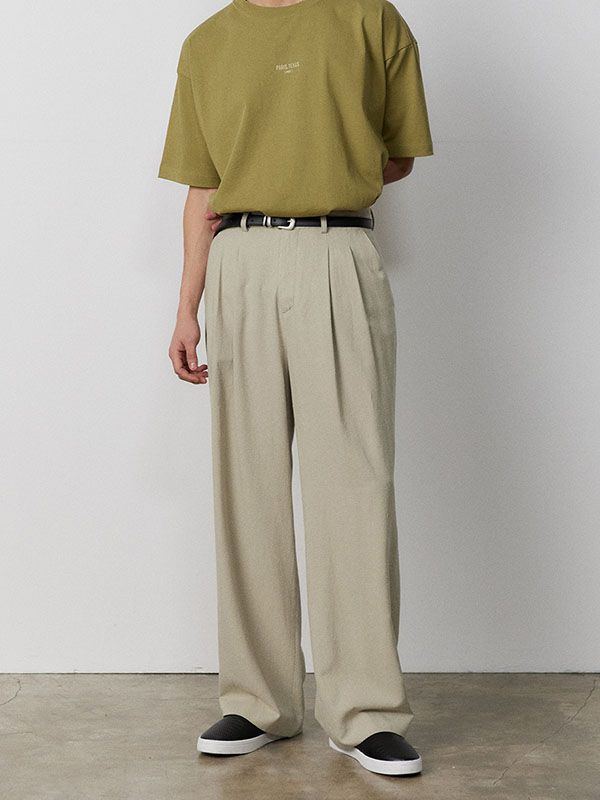 Editor's NotesThese wide pants are designed with front tucks for volume and relaxed silhouette that works well for versatile styling. Featuring vintage and cool material, they are made from nep mixed linen-blend which is recycled fabric has appearance like grains of sand in the desert and has softness from cotton and drapery from rayon.- Zip and real-horn button fastening- Two front slash pockets- Two back welt pockets- Front tucks- Wide fit- Unisex wearMeasurements (in.) XS / S / M / L- Waist: 14.0 in. / 15.0 in. / 16.5 in. / 17.5 in. - Front Rise: 12.8 in. / 13.2 in. / 13.8 in. / 14.2 in.  - Thigh: 13.2 in. / 13.8 in. / 14.8 in. / 15.4 in.- Hem: 10.0 in. / 10.4 in. / 10.8 in. / 11.2 in. - Total Length: 40.6 in. / 41.3 in. / 42.1 in. / 42.9 in.Model info: - Woman: Height 5' 6.1, Weight 10 Relaxed Fit Pants Men, Men’s Wide Leg Pants, Wide Pants Outfit Men, Soft Outfits Men, Mens Khaki Outfit, Wide Pants Men, Khaki Pants Outfit Men, Wide Pants Outfit, Wide Linen Pants