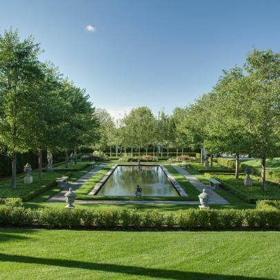 an outdoor garden with water and trees