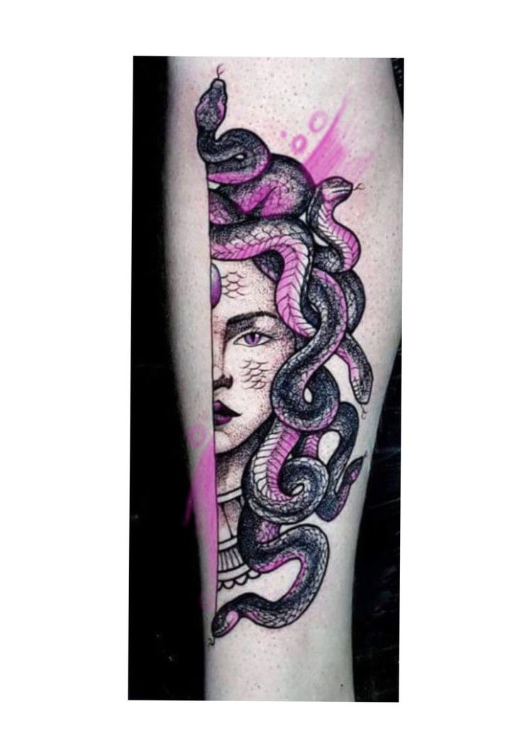 a woman with a snake tattoo on her leg