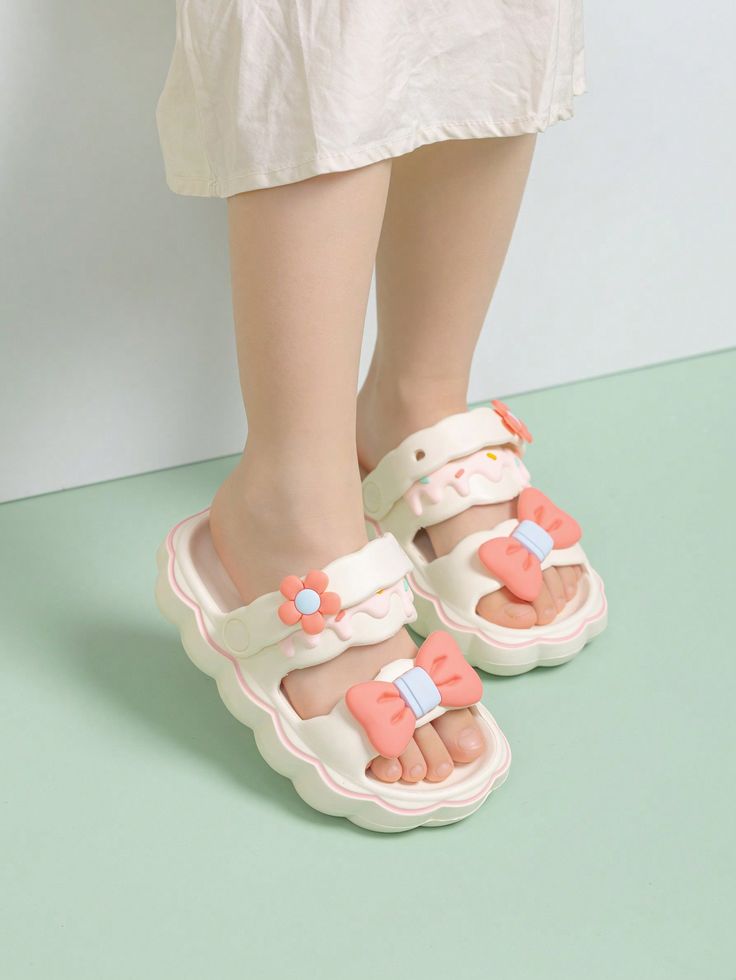 [COMFORTABLE&LIGHTWEIGHT]Our adorable girls clogs adopt a supportive, lightweight, breathable design, the profile sole that ensures a high level of operating comfort and prevents the foot from slipping. And there're also lightweight, odor-resistant and quick-drying.[DURABLE&STYLISH]With a 3.3cm waterproof line design, our girls clogs are easy to clean and resistant to water damage. Besides, The stylish bowknot and flower charms add a fashionable touch to every step.[ADJUSTABLE&VERSATILE]These ki Kawaii Sandals, Girls Clogs, Kids Clogs, Indoor Shoes, Garden Water, Water Sandals, Water Damage, Water Garden