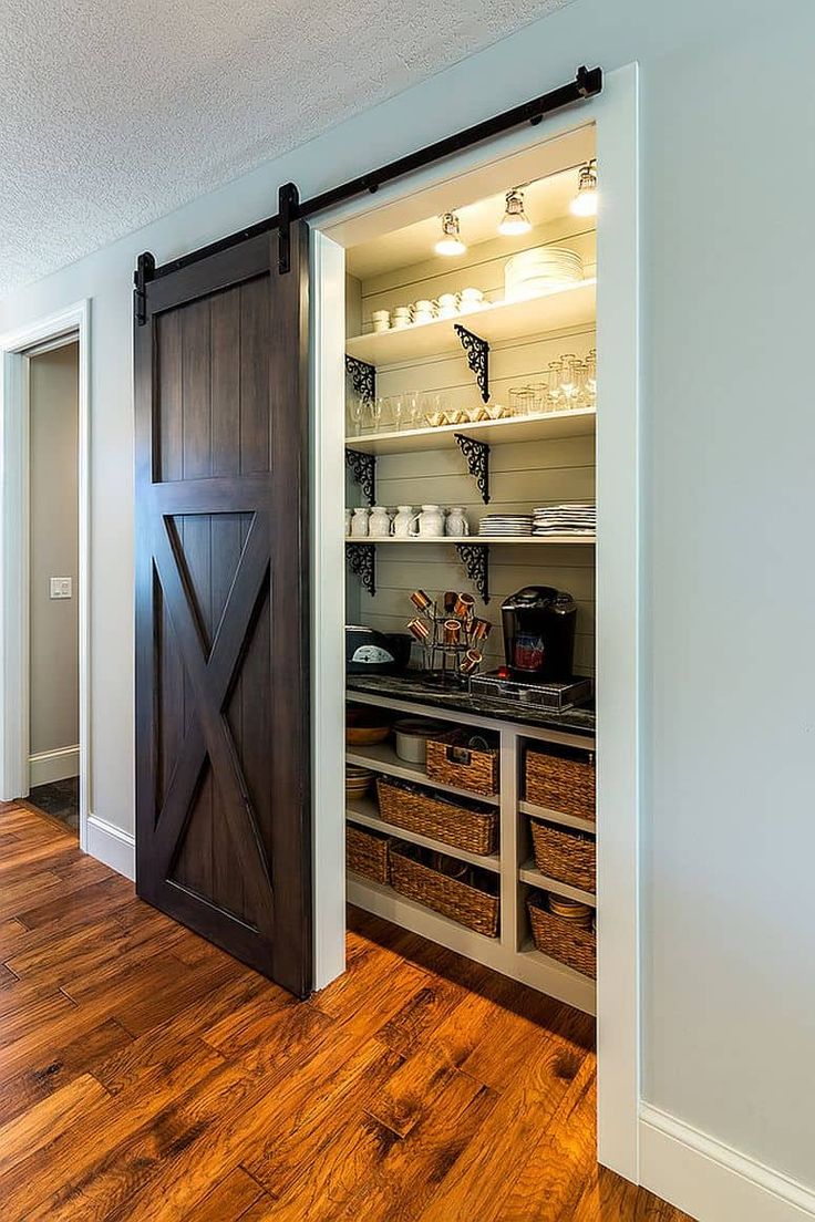 an open sliding barn door in a kitchen