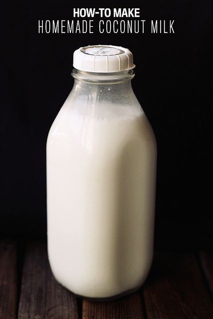 a bottle of milk sitting on top of a wooden table