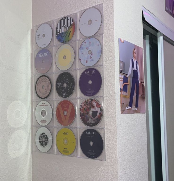 there are many cds hanging on the wall