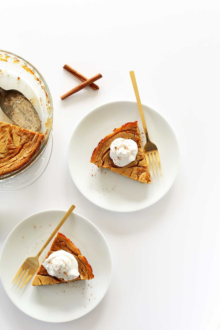 three white plates with slices of pie on them and cinnamon sticks in the bowl next to them