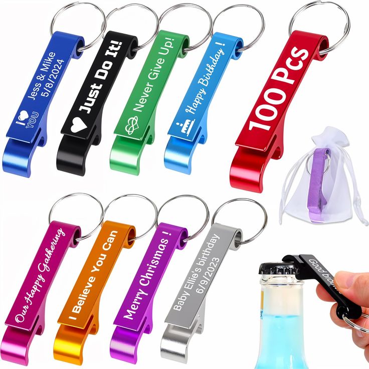 a hand holding a bottle opener with several different colored key chains attached to the bottles