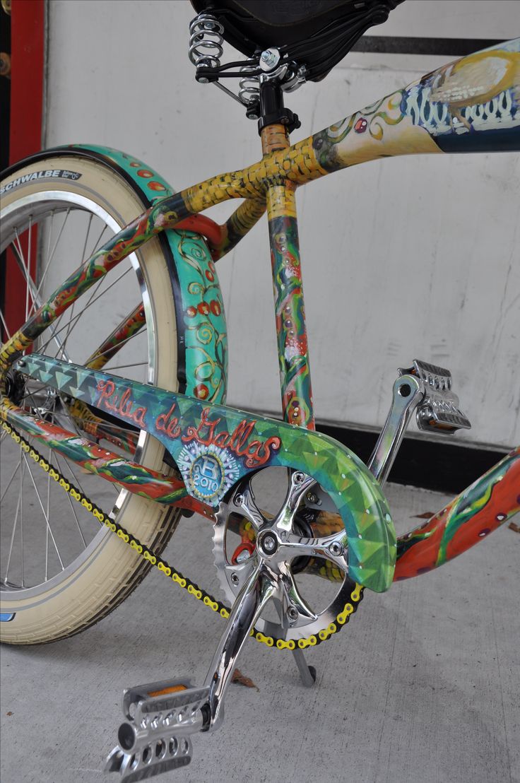 a colorful bicycle parked in front of a building