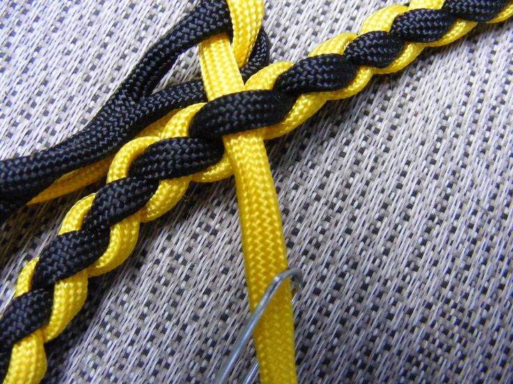 a yellow and black rope on top of a gray shirt