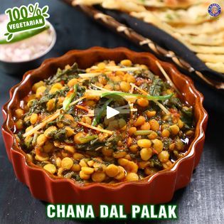 an image of chana dal palak with vegetables in it and other food items on the table