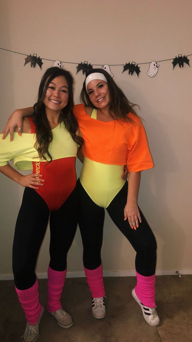 two women in costumes posing for the camera