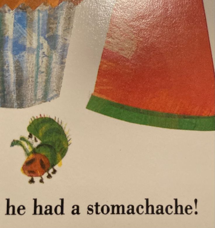 a close up of a book with a cupcake on the cover and an image of a caterpillar