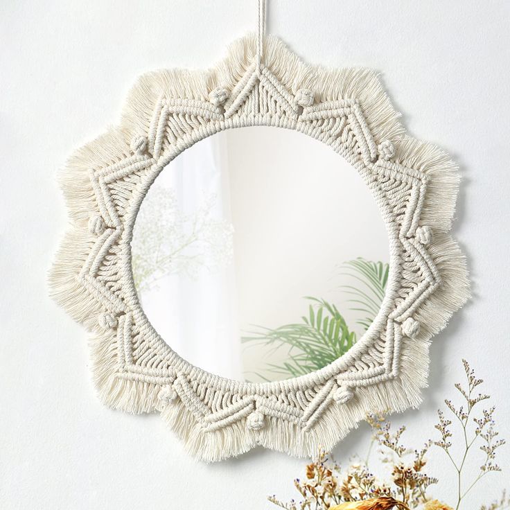 PRICES MAY VARY. 【Size and Detail】The total diameter with fringe is 15"（38cm）, the diameter of the mirror is about 9"（23cm）.NOTE-There is a protective film on the surface of the mirror. Please tear it before usage to ensure its high definition. 【High Quality Material】Our macrame wall hanging is made of 100% pure cotton cord and acrylic mirror，sturdy and premium quality.Exquisite weaving process design,elegant and chic. It is a beautiful wall art,creating a sense of harmony and comfort for your r Nursery Beige, Antique Mirror Frame, Macrame Fringe, Boho Mirror, Macrame Wall Hanger, Macrame Mirror, Handmade Mirror, Handmade Mirrors, Bohemian Handmade