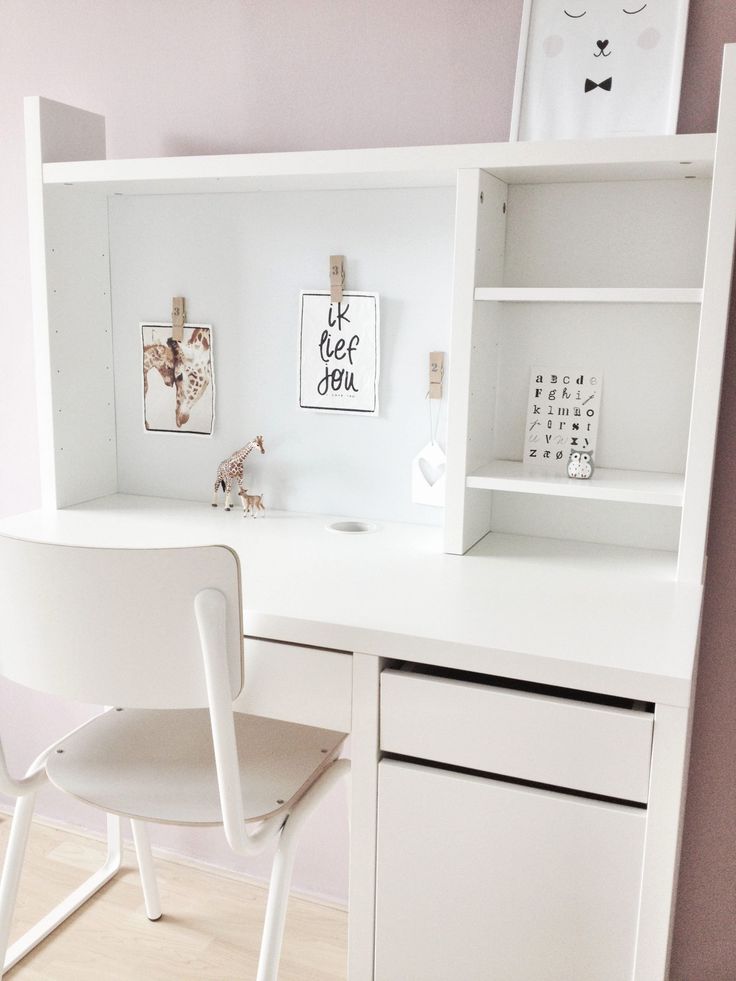 a white desk and chair in a room