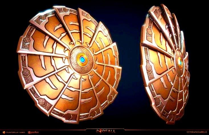 two golden plates with designs on them sitting side by side in front of a black background