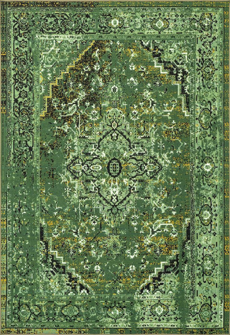 a green rug with an ornate design on the top and bottom, in different colors