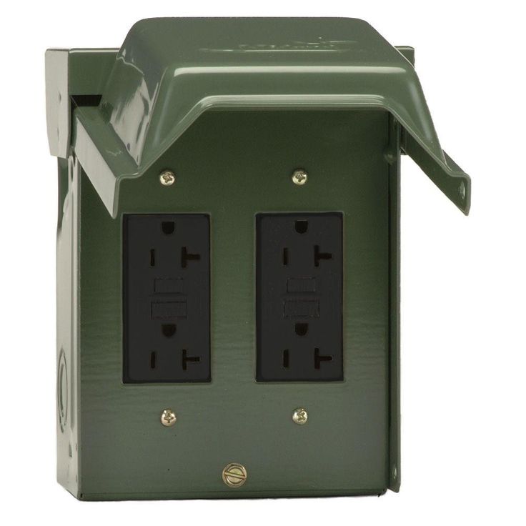 an electrical outlet cover with two black outlets and one green box on the left side