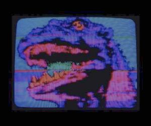 an old television screen with the image of a large dinosaur on it's face