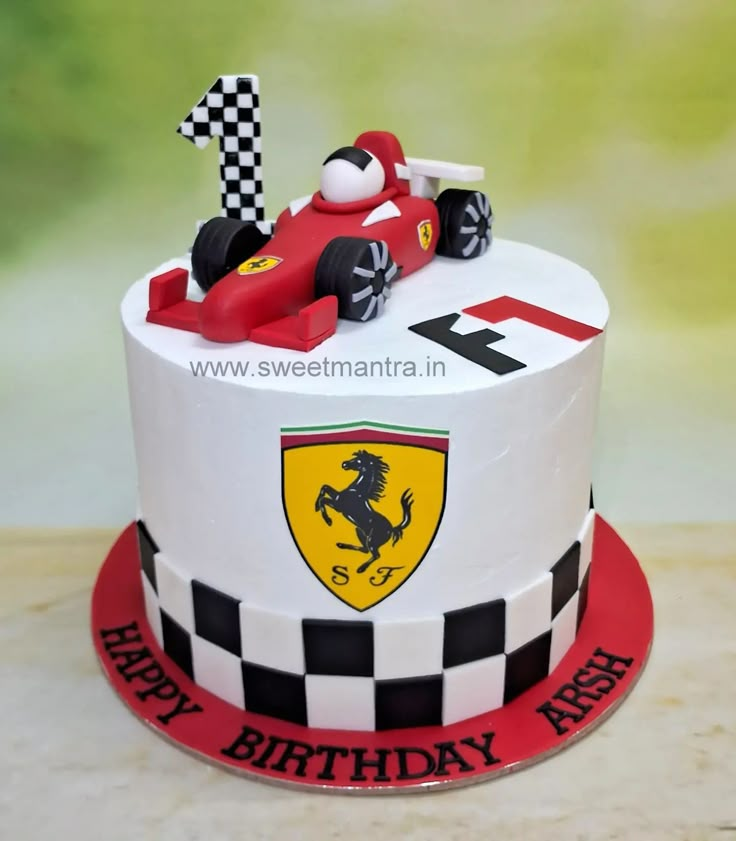 a birthday cake with a racing car on top