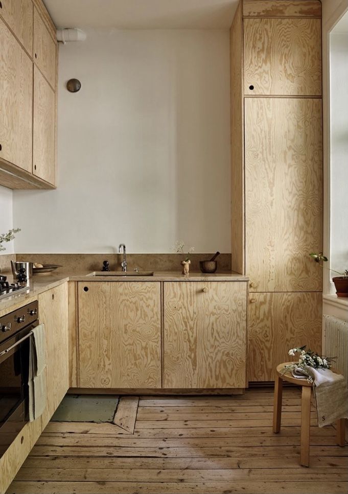 a kitchen with wooden cabinets and an oven