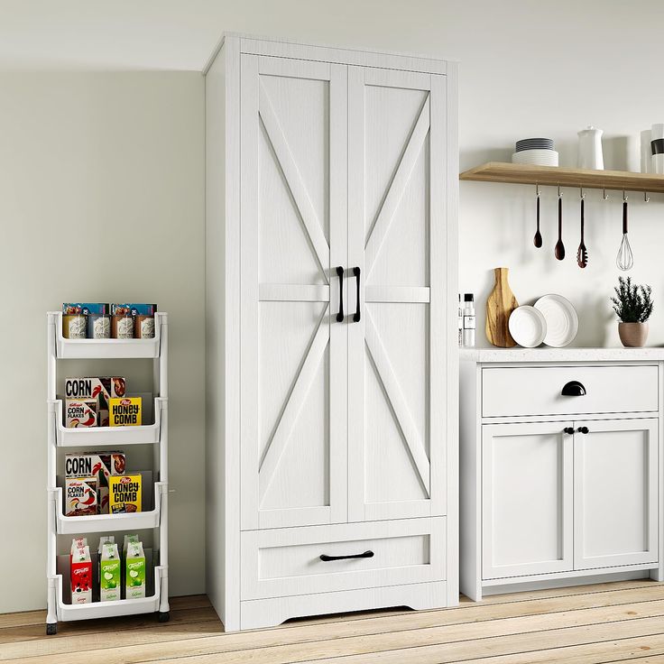 a kitchen with white cupboards and shelves filled with spices, condiments and utensils