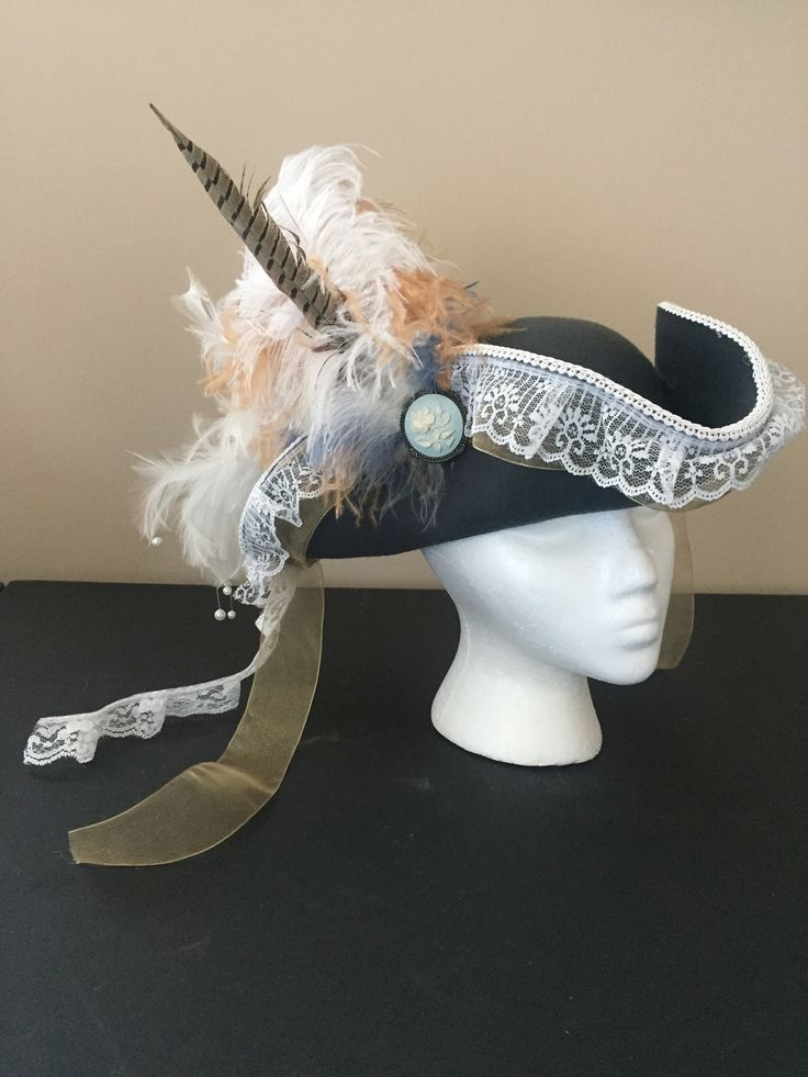 Super luxurious pirate hat. Lots of feathers and a pretty broach.  Woman's sized hat 20 to 21 inches. The color is a pretty steel blue with white and beige feathers.  Have a customization request? Colors, accents, etc? send me a message. Pirate Garb, Medieval Rings, Pirate Outfit, Hat Aesthetic, Viking Costume, Pirate Hat, Pirate Hats, Witchy Fashion, Boater Hat