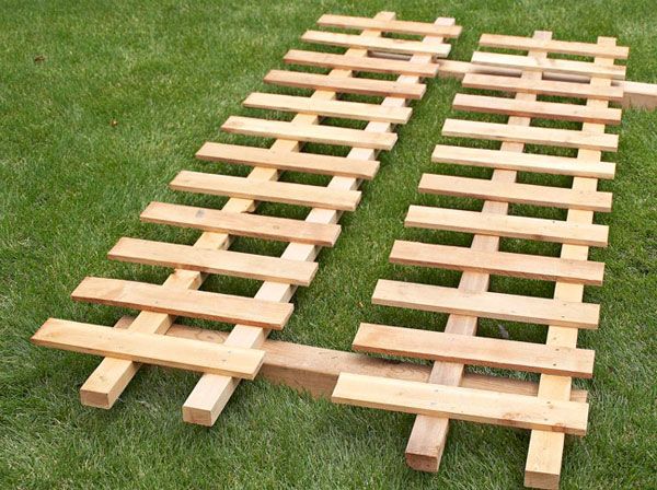 several pieces of wood laid out on the grass