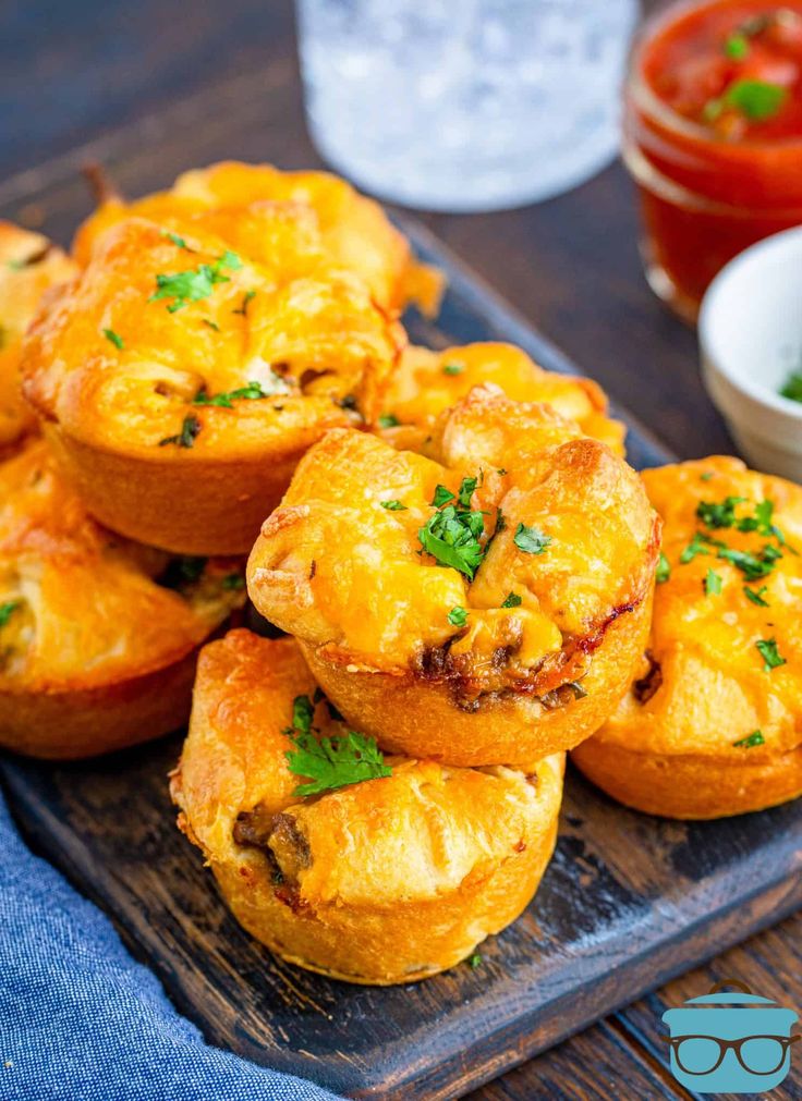 several small muffins on a wooden tray