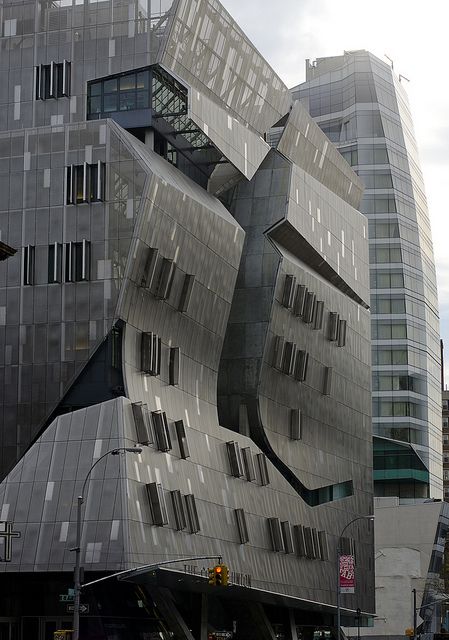 an unusual building in the middle of a city