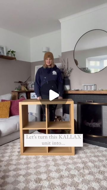 a woman is standing in front of a television set with the caption let's turn this kallax uni into