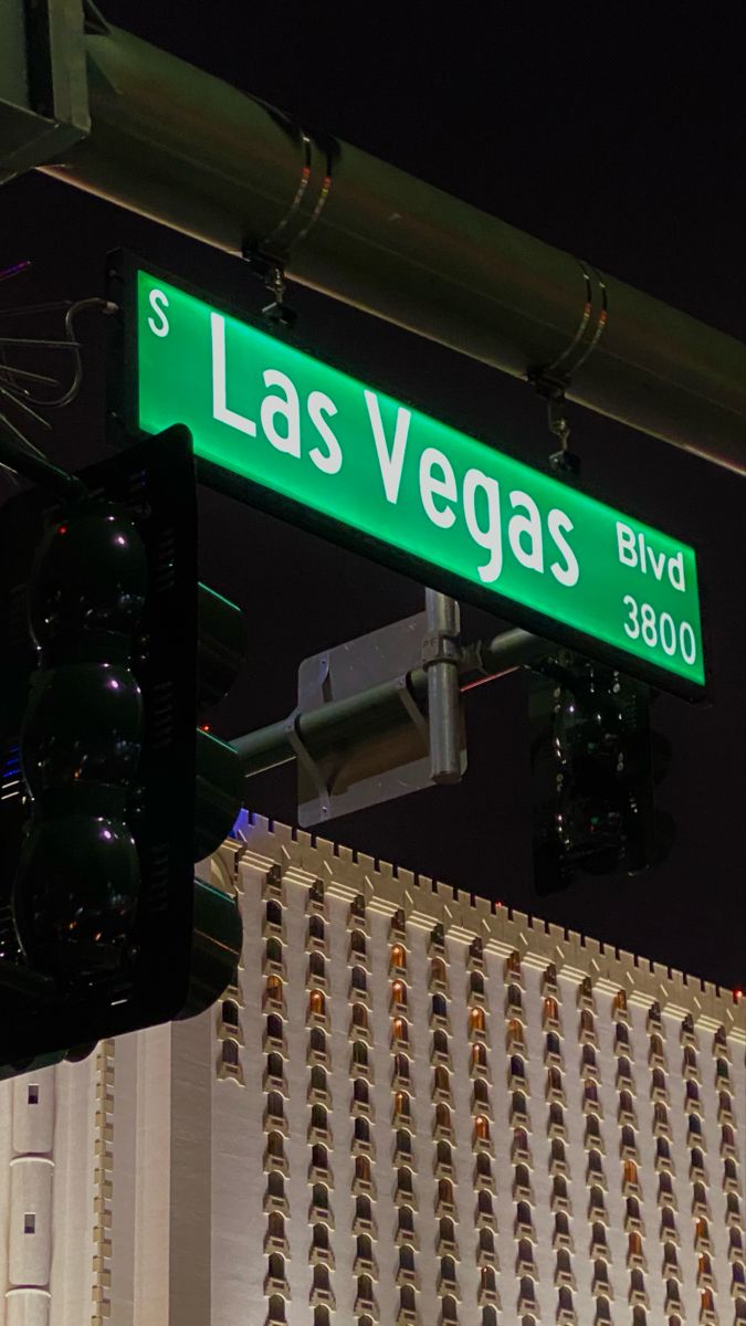 the street sign for las vegas blvd is green