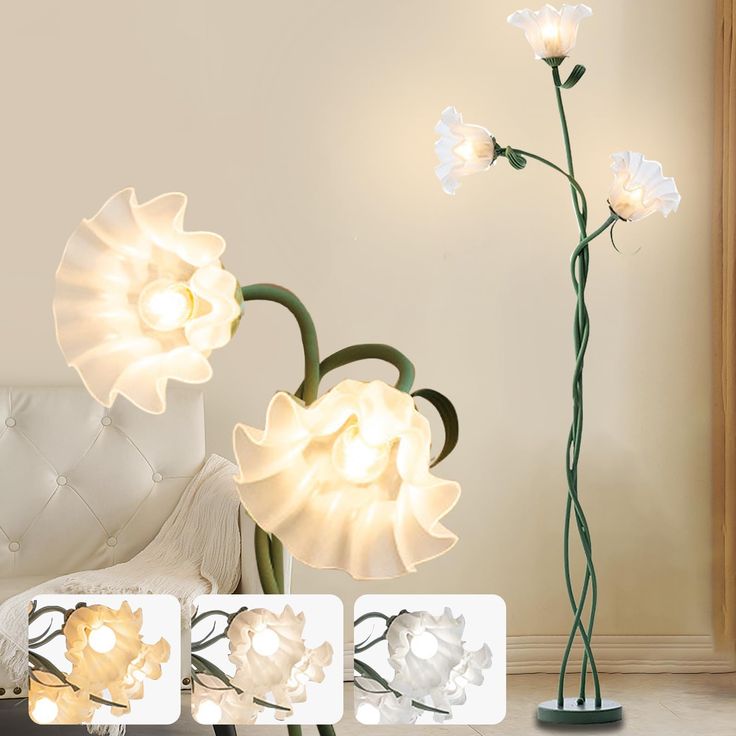 three white flowers are lit up on the floor in front of a couch and chair