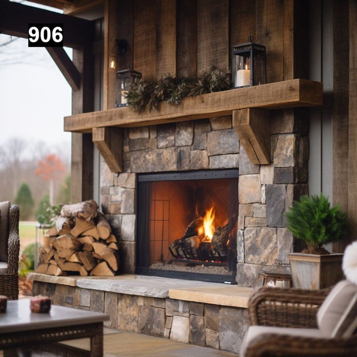 an outdoor fireplace with logs and christmas decorations